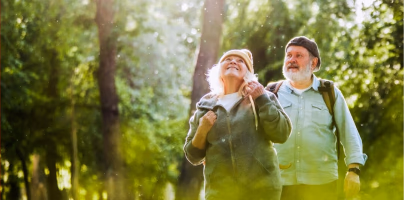 Older couple walking together in a sunlit forest, looking upward and smiling, with the headline “Study Reveals Why Some Seniors Recover After a Health Crisis—While Others Don’t and source label “Epoch Health.